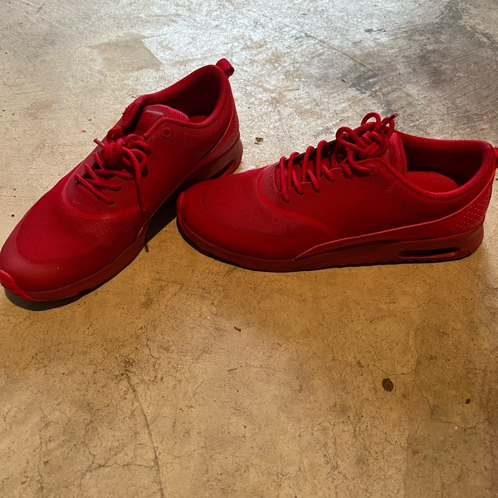 All red Nike Thea